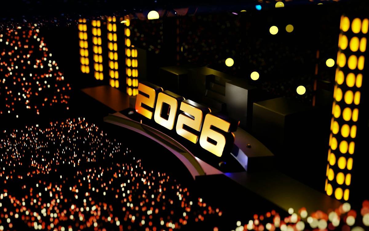 Arthur Ashe Stadium during the 2019 Fortnite World Cup Finals, packed with 20,000 fans under stadium lights with massive LED screens showing live gameplay